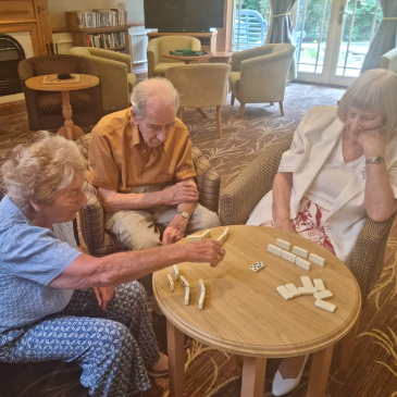 Residents playing dominoes at Southlands