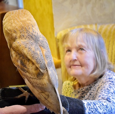 Resident holding bird of prey