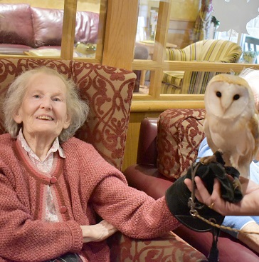 Resident holding bird of prey