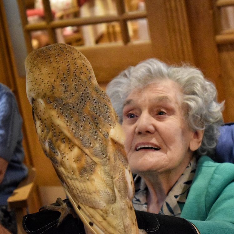 Resident holding bird of prey