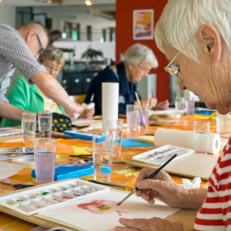 Resident enjoys painting - Westward Care