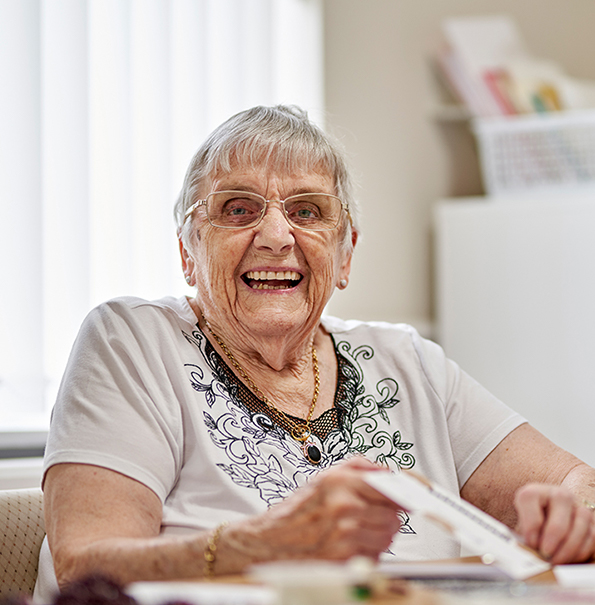 Carer laughs with resident - Westward Care