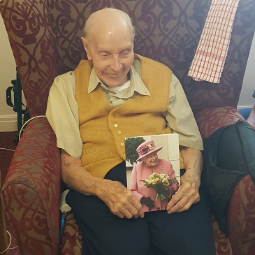 Len with his 100th birthday card from the Queen